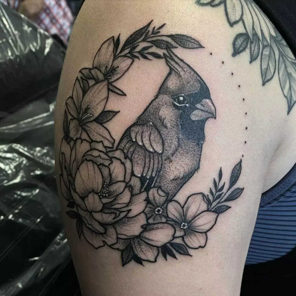 A black and grey tattoo of a bird in Houston.