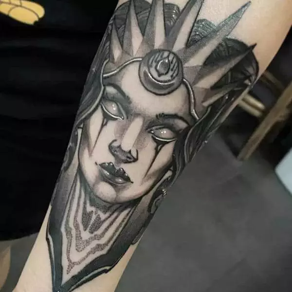 A crown-bearing woman tattoo on the forearm, done by the best tattoo artist in Houston or Katy.
