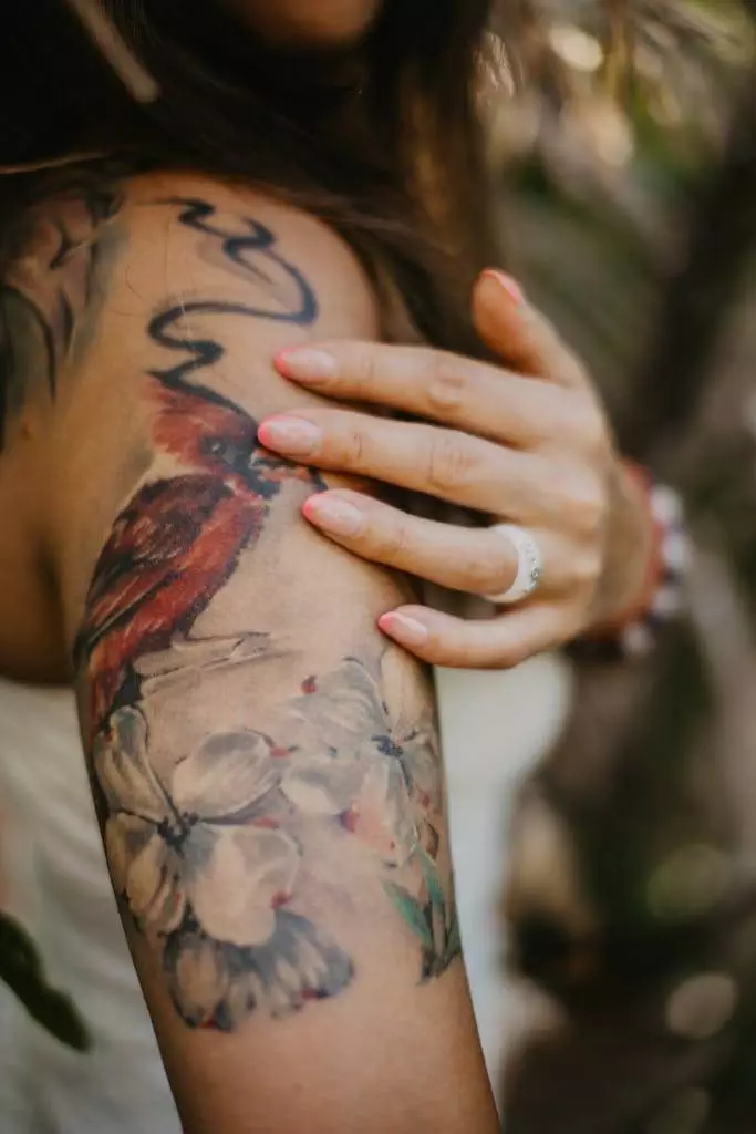 Close Up Shot of Human Arm with Tattoos